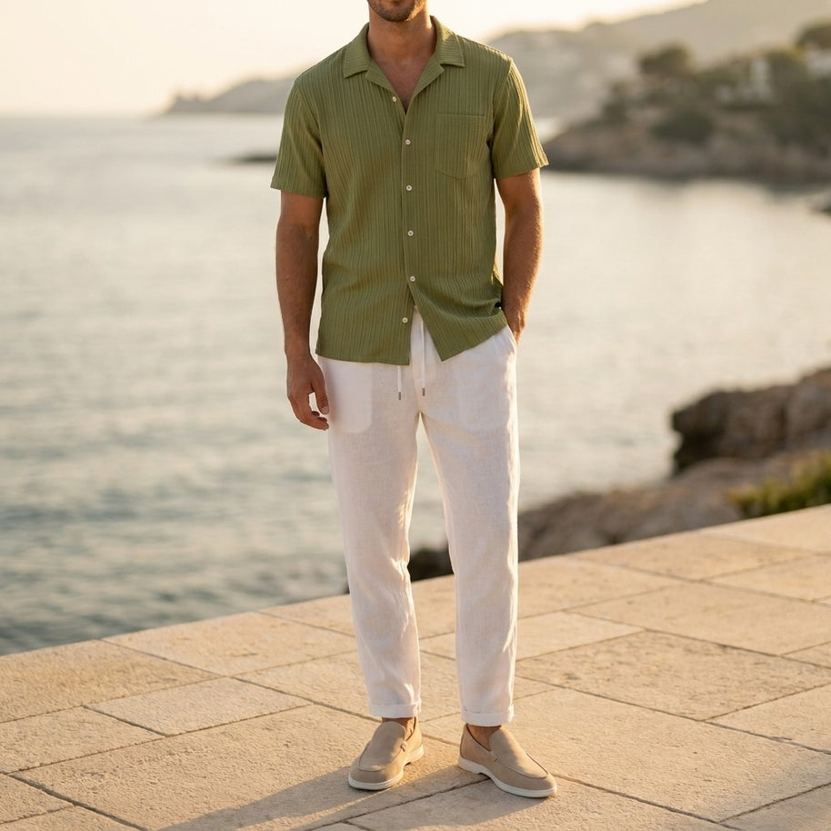 Man wearing the Olive four-piece set on a Mediterranean terrace