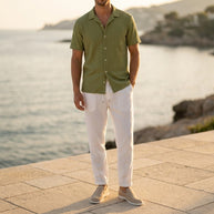 Man wearing the Olive four-piece set on a Mediterranean terrace