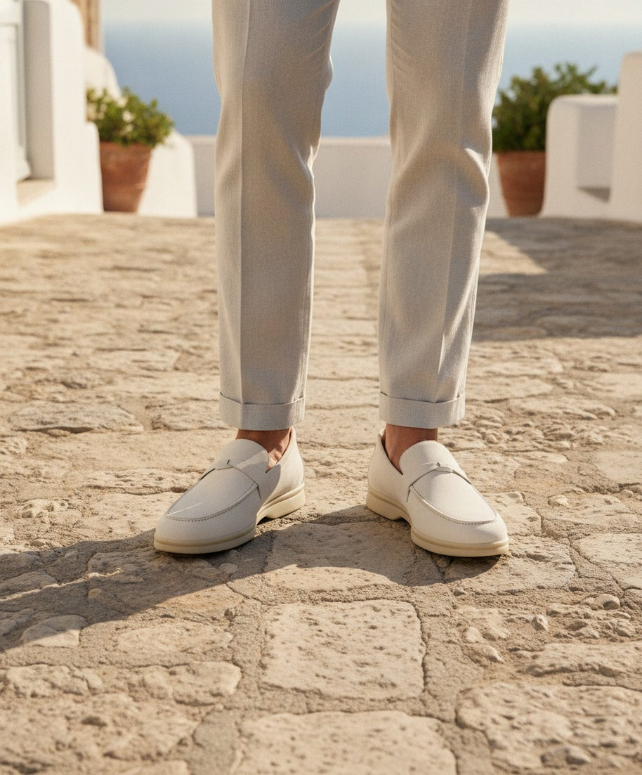 Man wearing the Looksmaxxing Marbella elevator loafer on a Mediterranean street