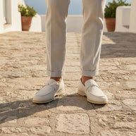 Man wearing the Looksmaxxing Marbella elevator loafer on a Mediterranean street