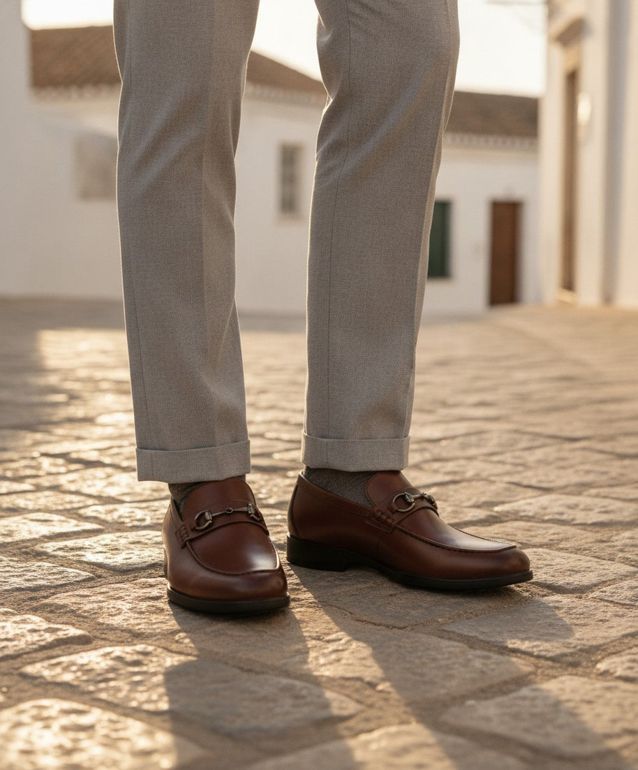 Man wearing the Looksmaxxing Bari elevator slip-on on a Mediterranean street