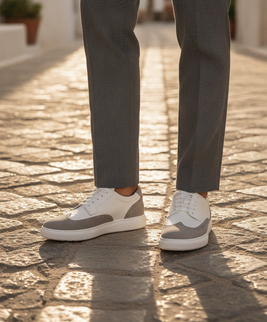 Man wearing the Looksmaxxing Palermo elevator trainers on a Mediterranean street