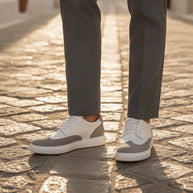 Man wearing the Looksmaxxing Palermo elevator trainers on a Mediterranean street