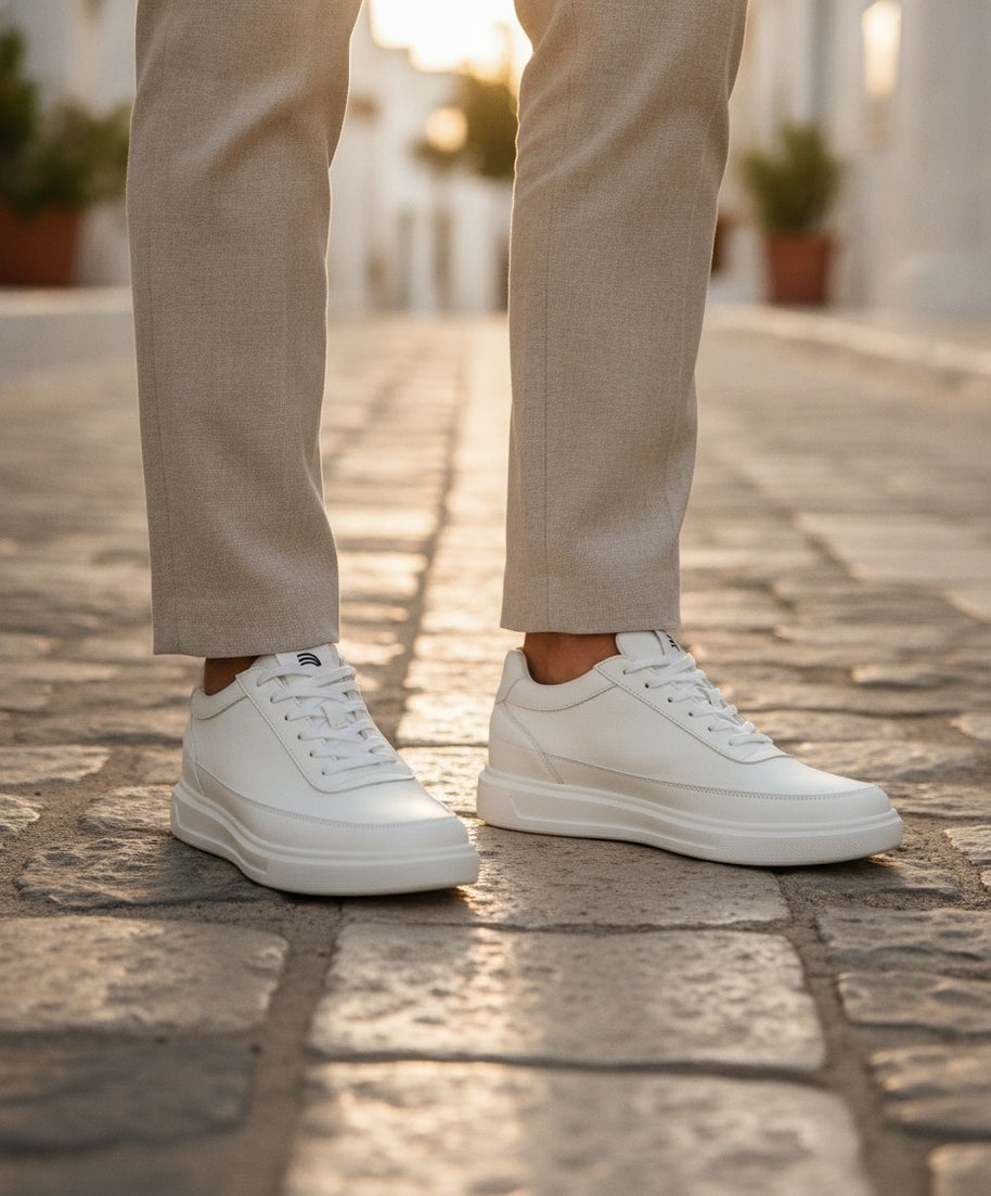 Man wearing the Looksmaxxing Amalfi elevator trainers on a Mediterranean street
