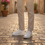 Man wearing the Looksmaxxing Cefalu platform trainers on a Mediterranean street