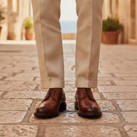 Man wearing the Looksmaxxing Lucca elevator brogue on a Mediterranean street