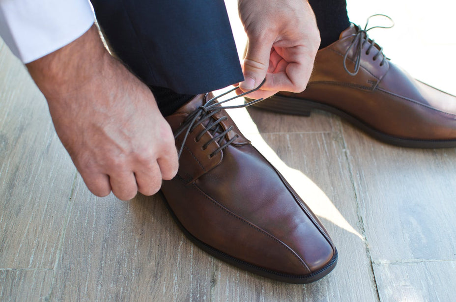 Regular dress shoe being tied